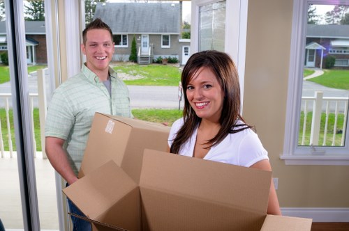 Removal team preparing household items for transport in Kingston