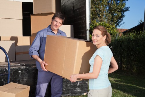 Packed student items including books, clothes, and small furniture for storage